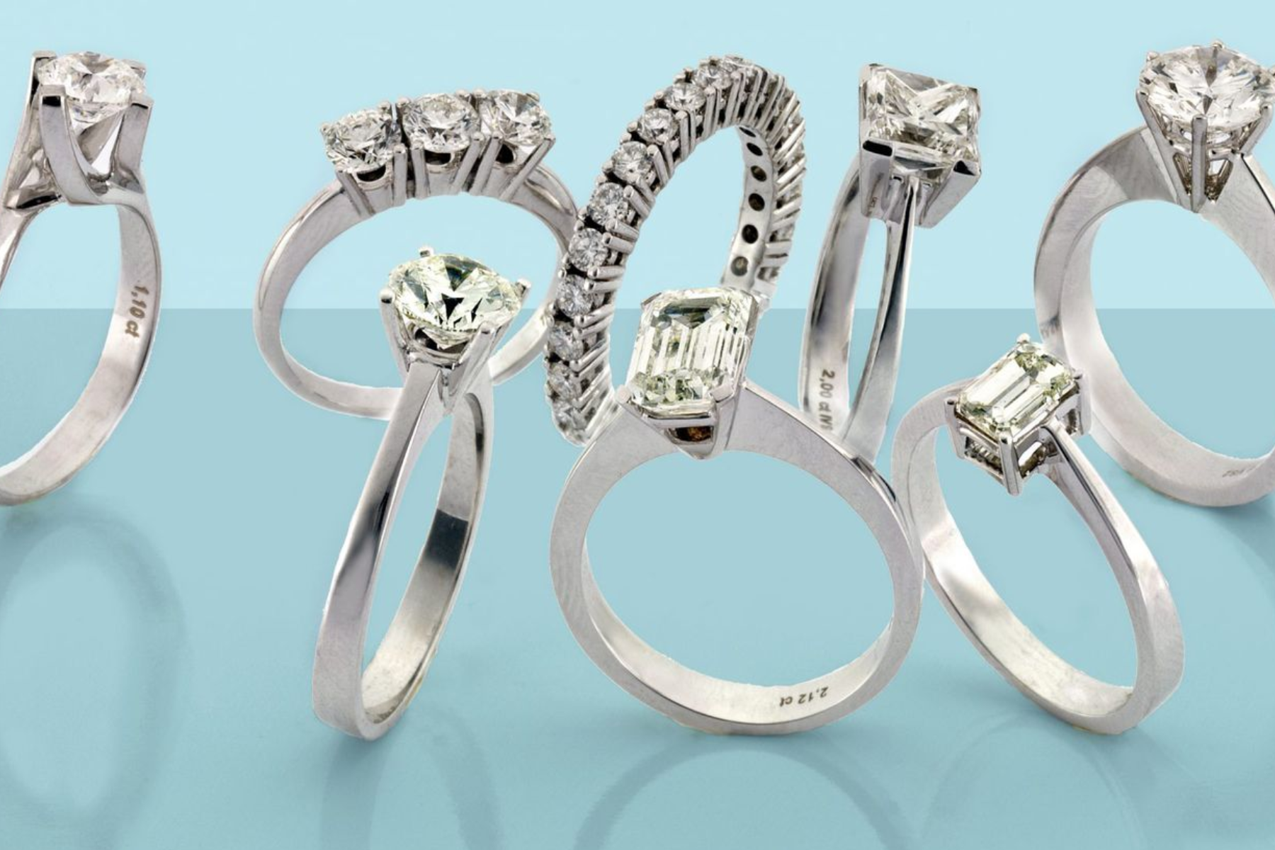 A photo of eight rings with various diamond cuts