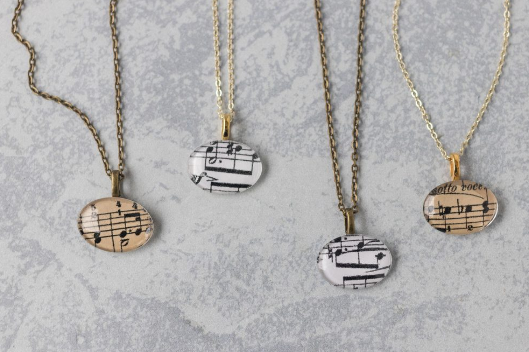 Four music notes necklaces