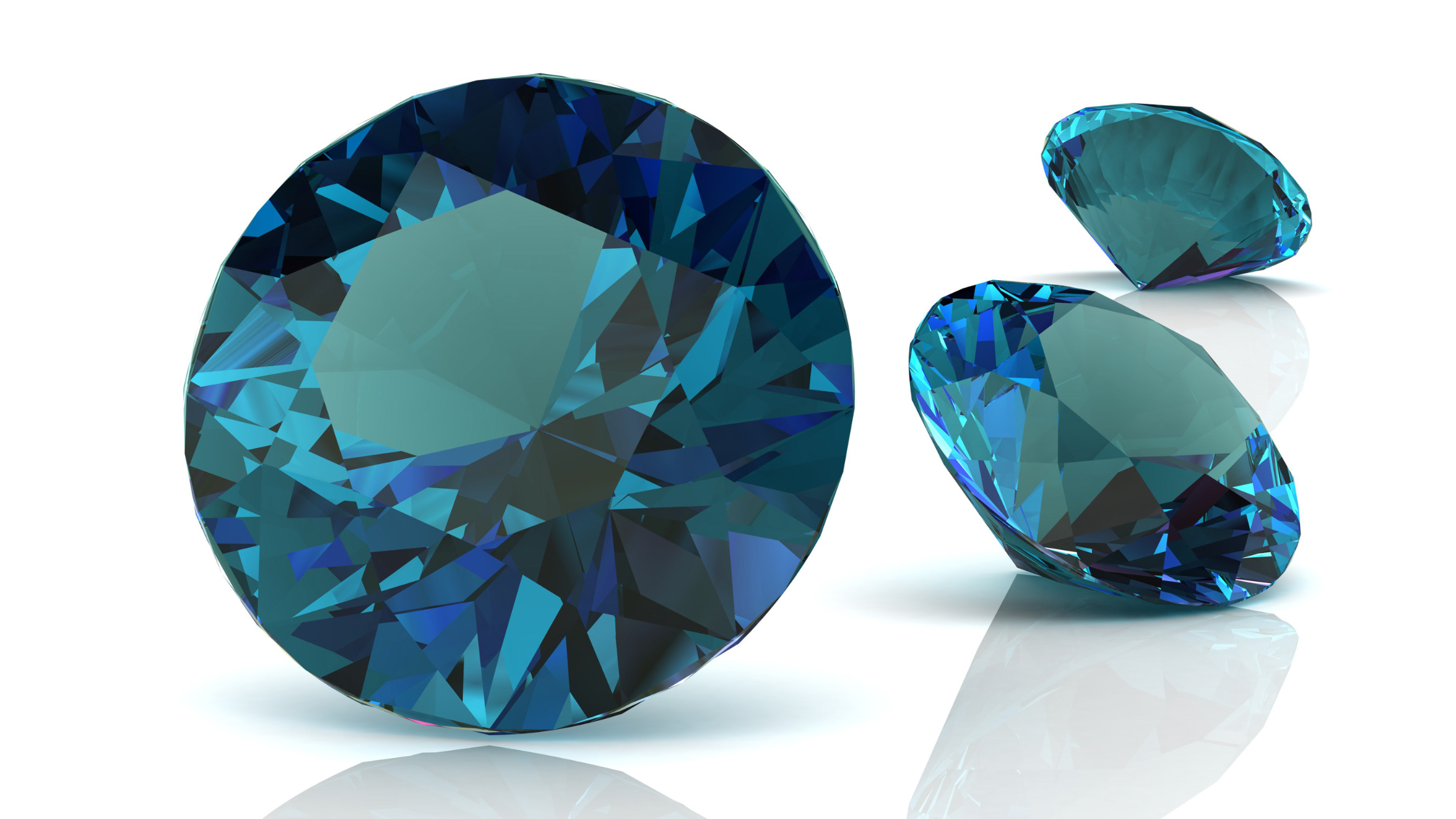 A photo of three alexandrite gemstones