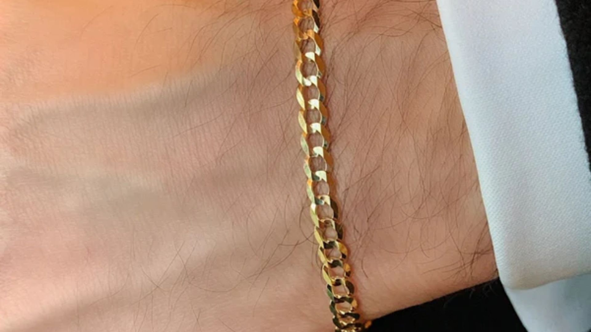 Gold Chain On Man's Wrist