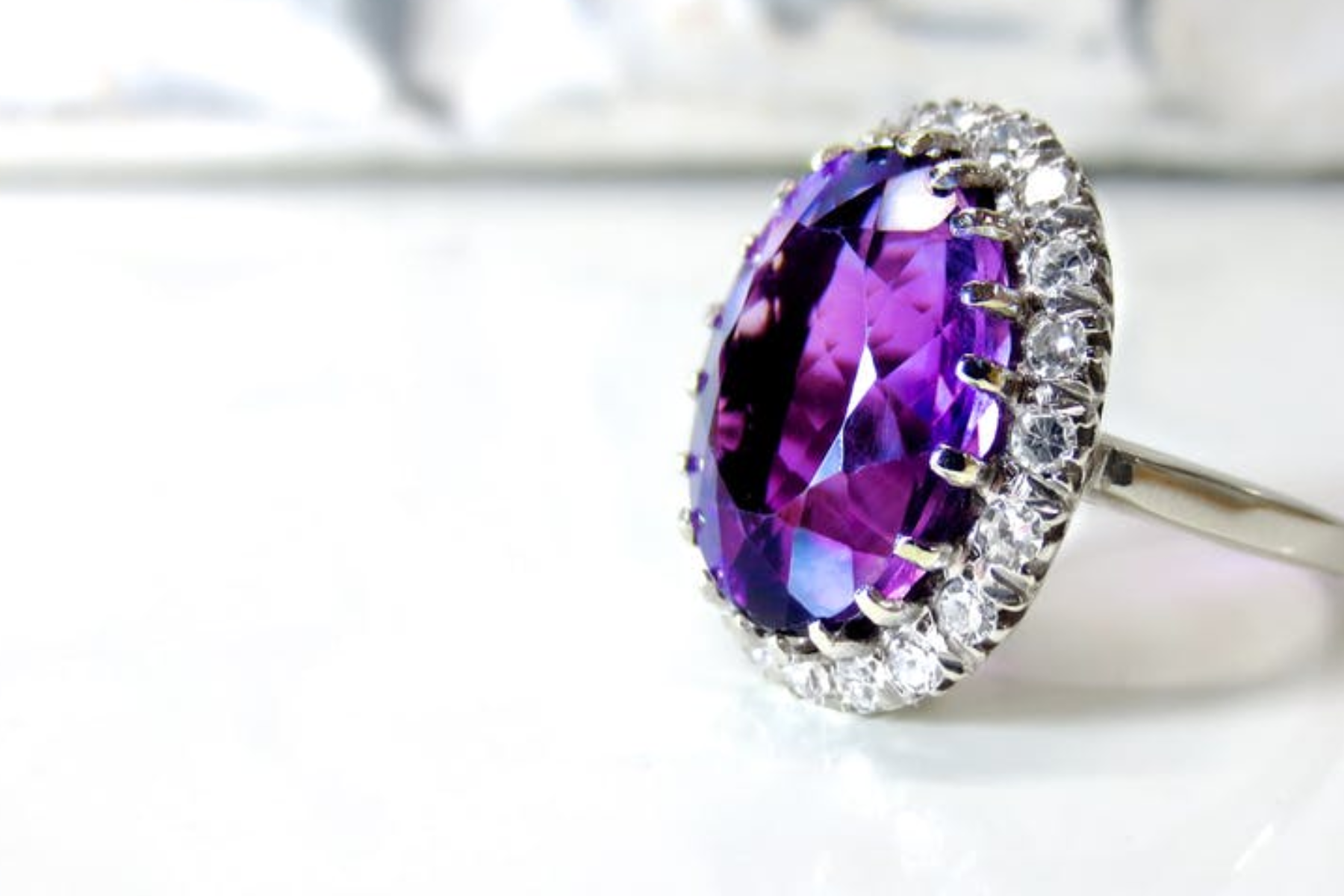 An engagement ring featuring a purple gemstone