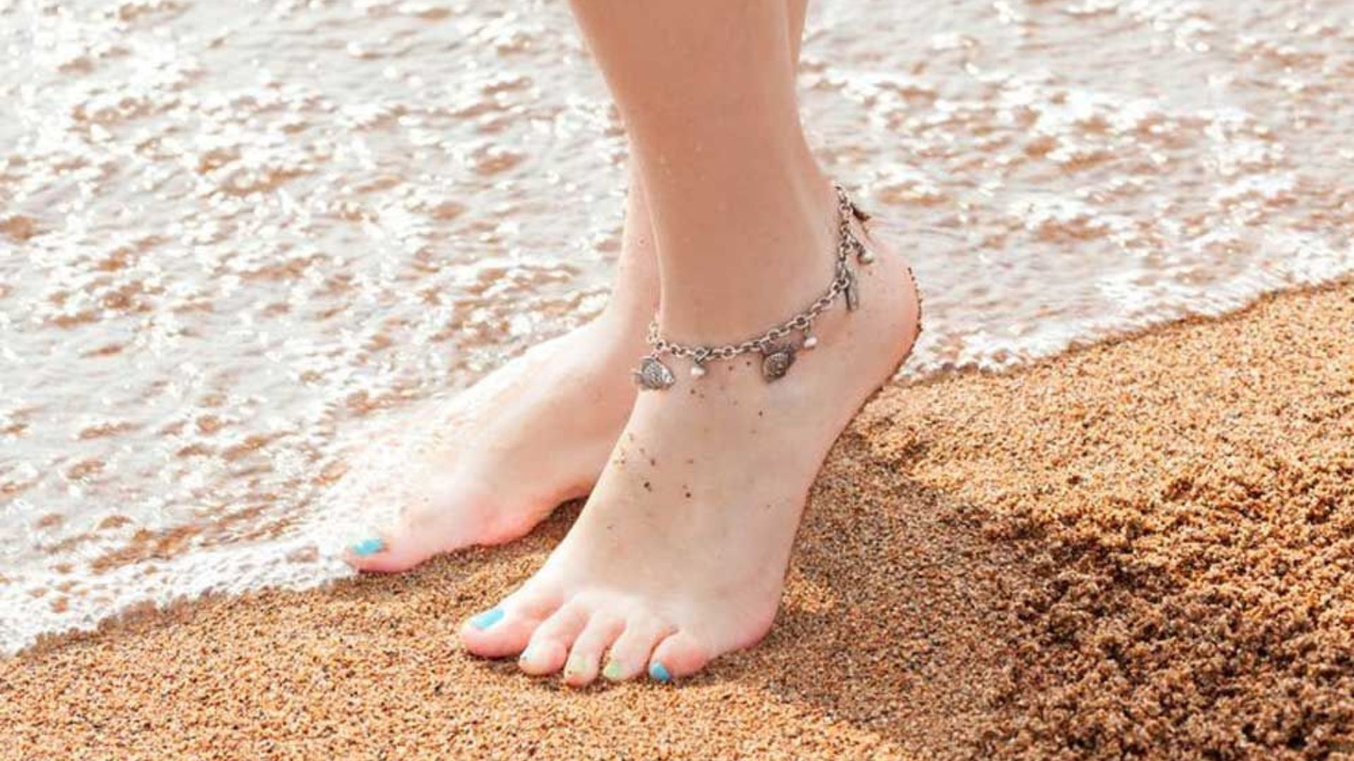 A Bracelet On Women Anklet Standing On  Beach