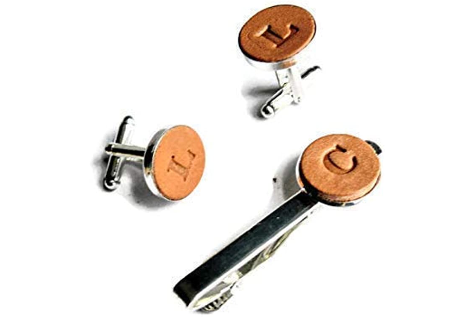 Leather cufflinks and a necktie clip with an initial made of leather