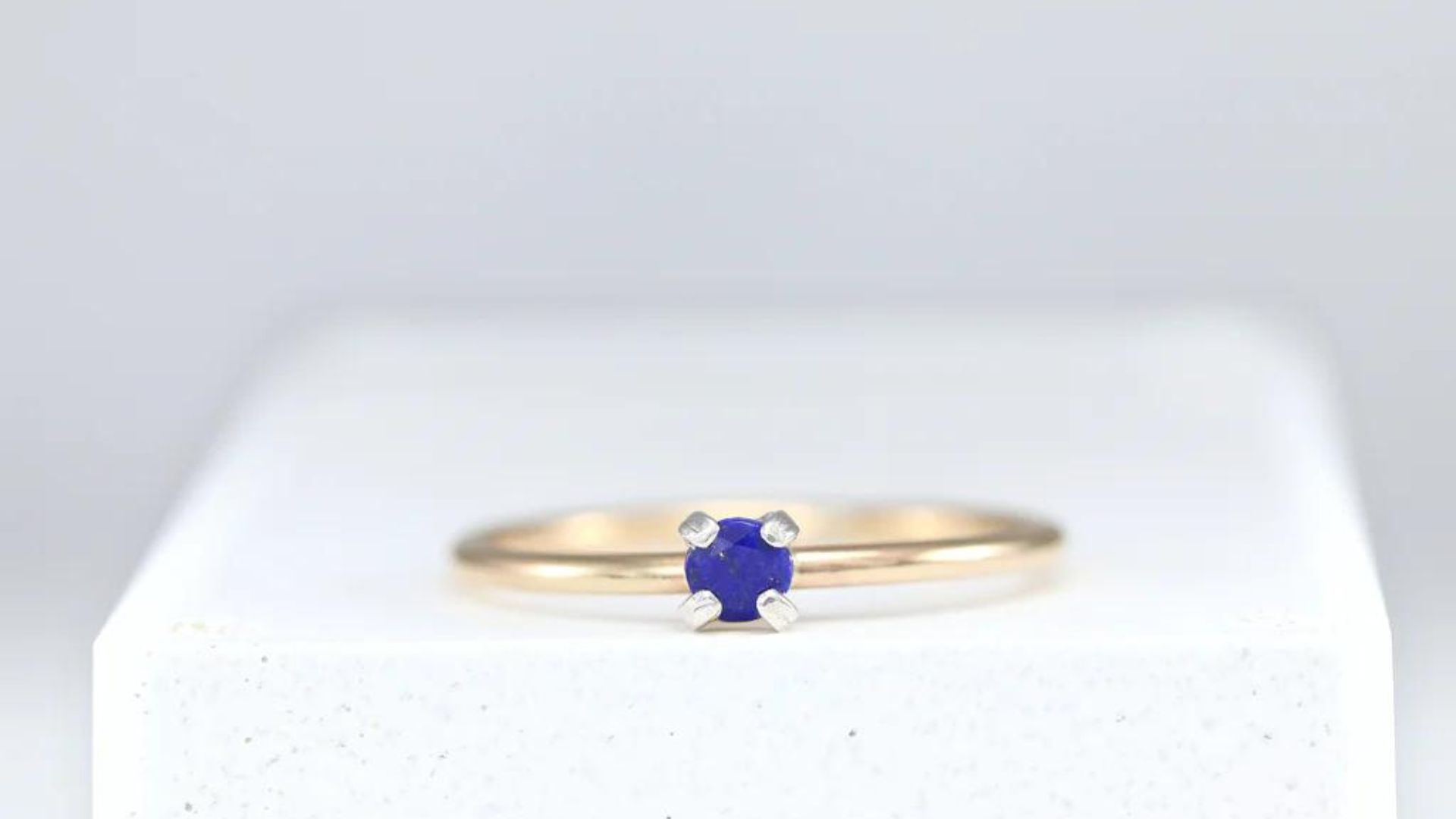 A Silver Ring With Small Blue Stone