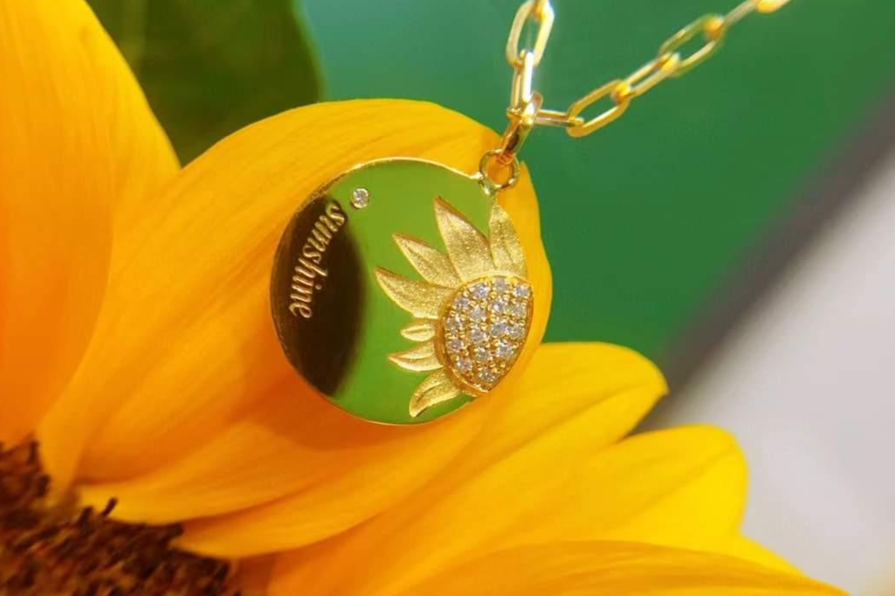 A sunflower pendant perched atop a sunflower