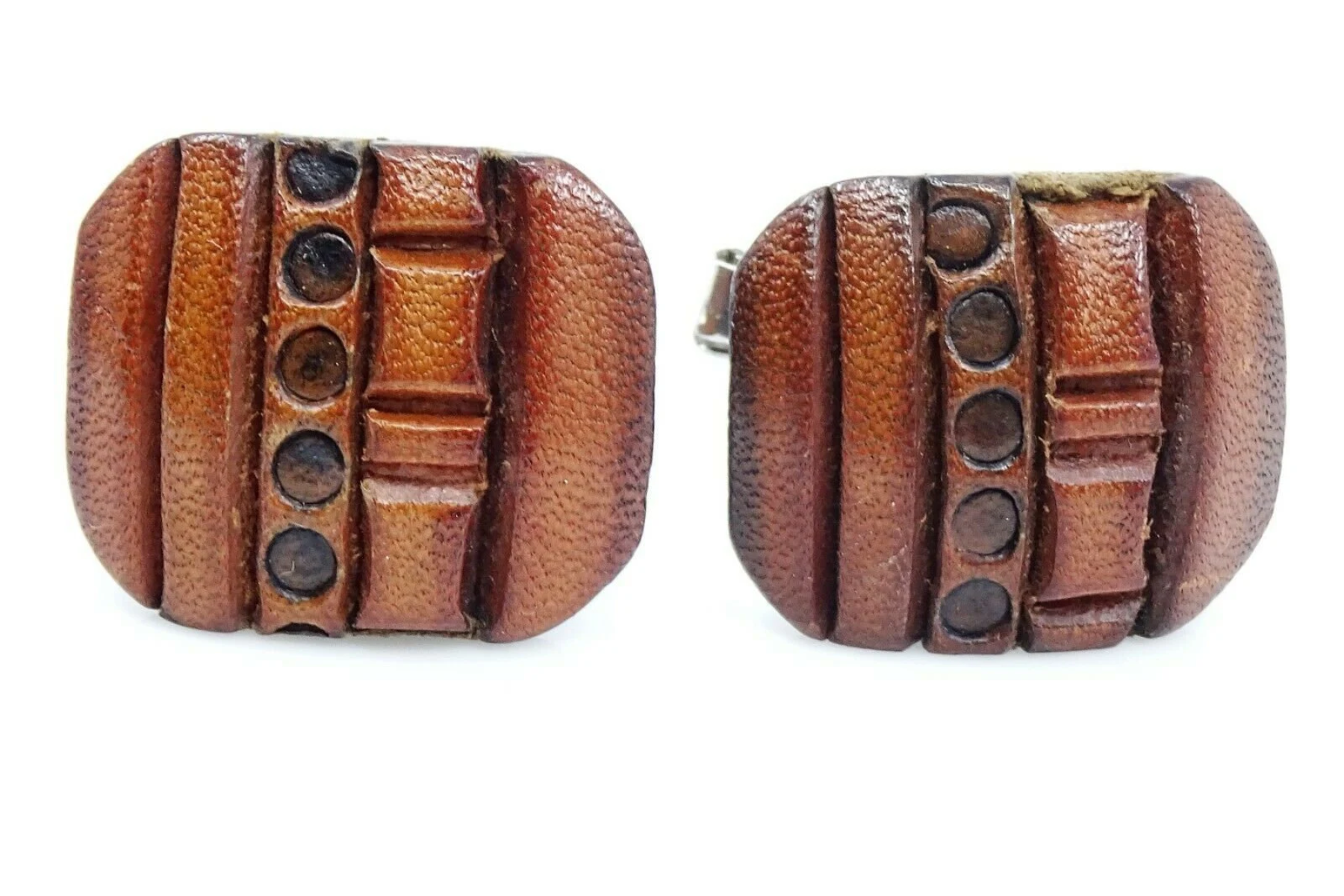Leather cufflinks on a white background