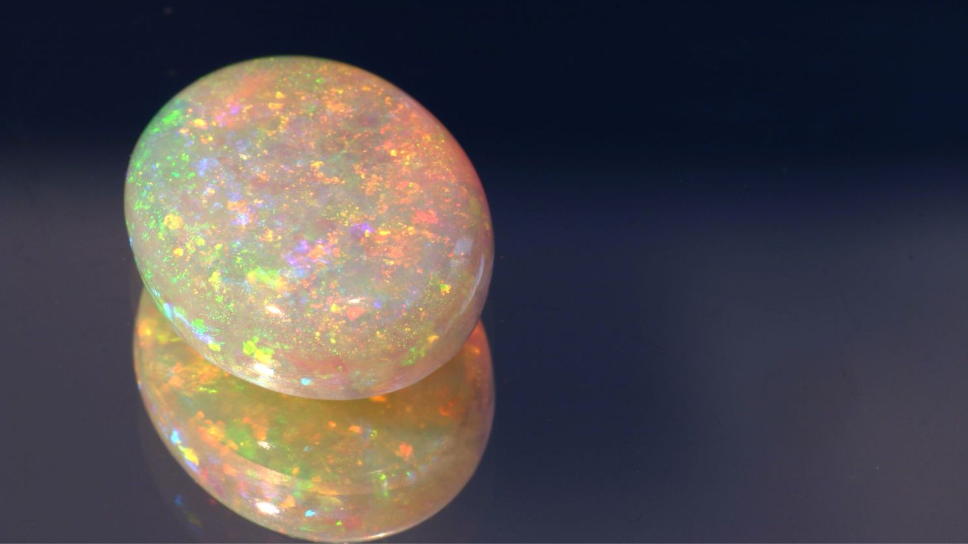 Multicolored Gemstone On Clear Surface