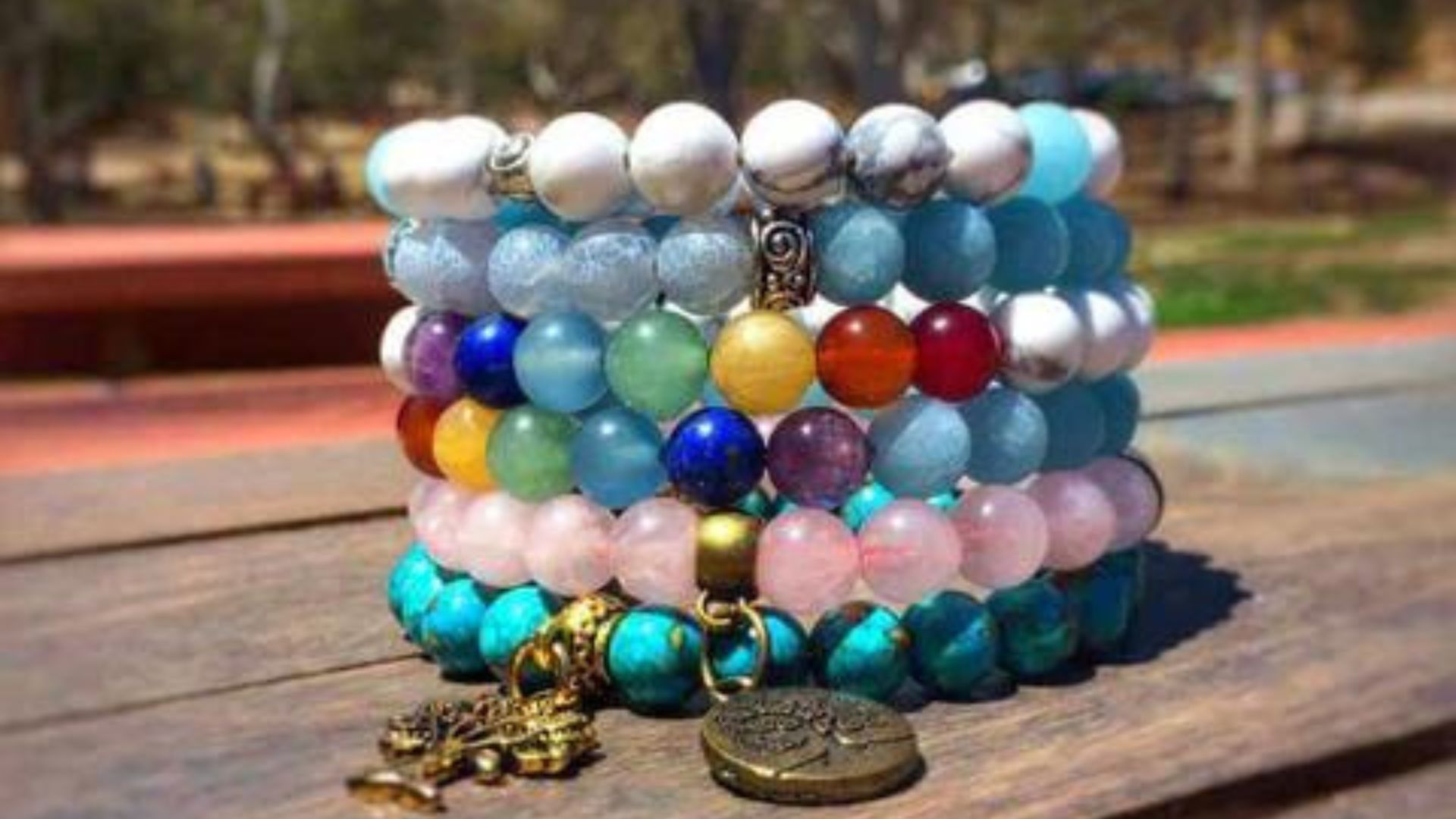 Different Multi Color Bracelets On A Wooden Table