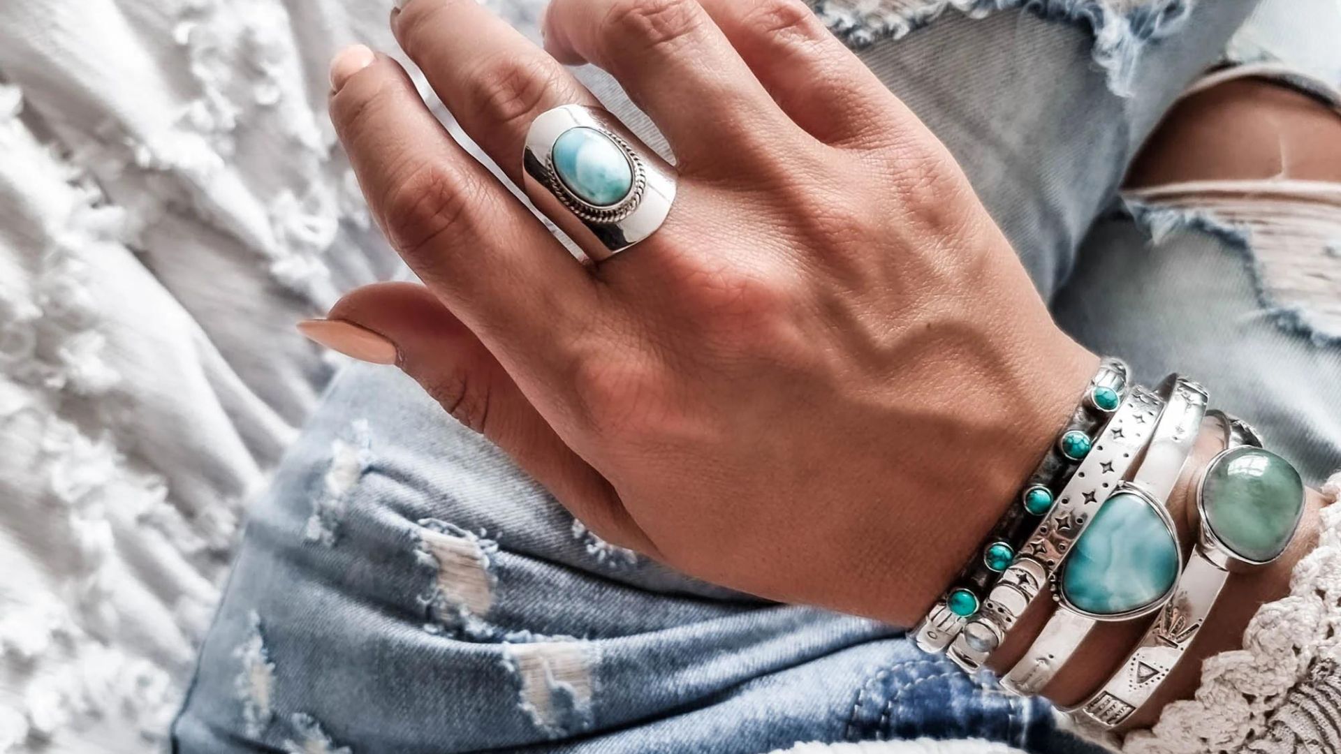 A Woman Wearing Blue Color Stone Ring