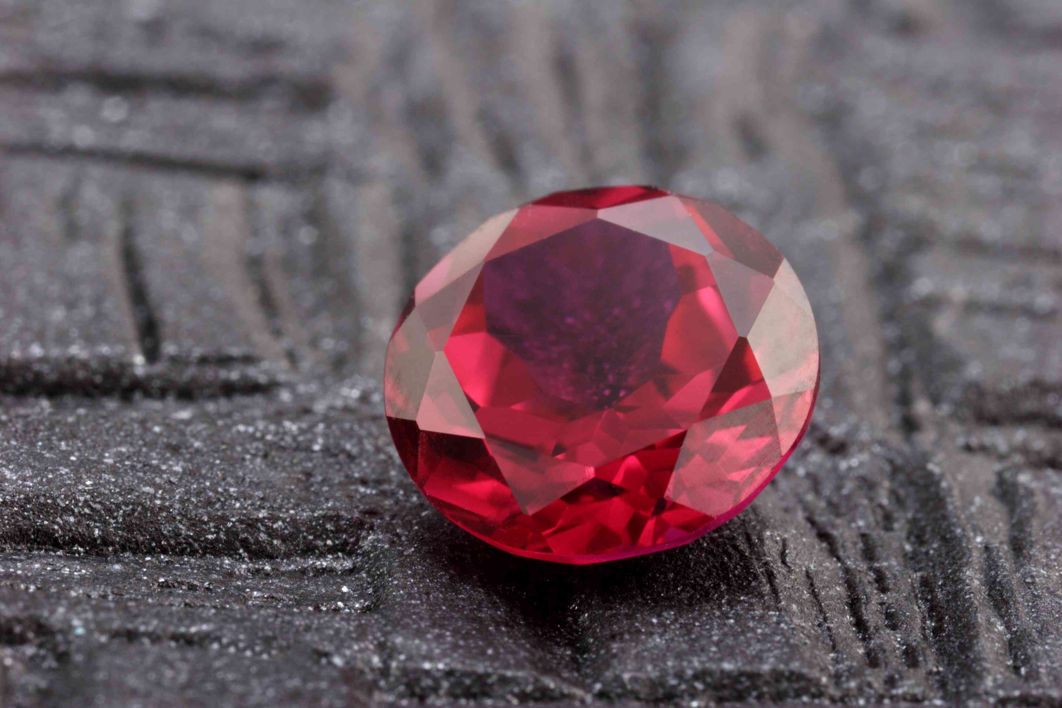 An image of a ruby stone that is associated with the month of July