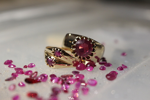 Two ruby jewel rings with mini stones around
