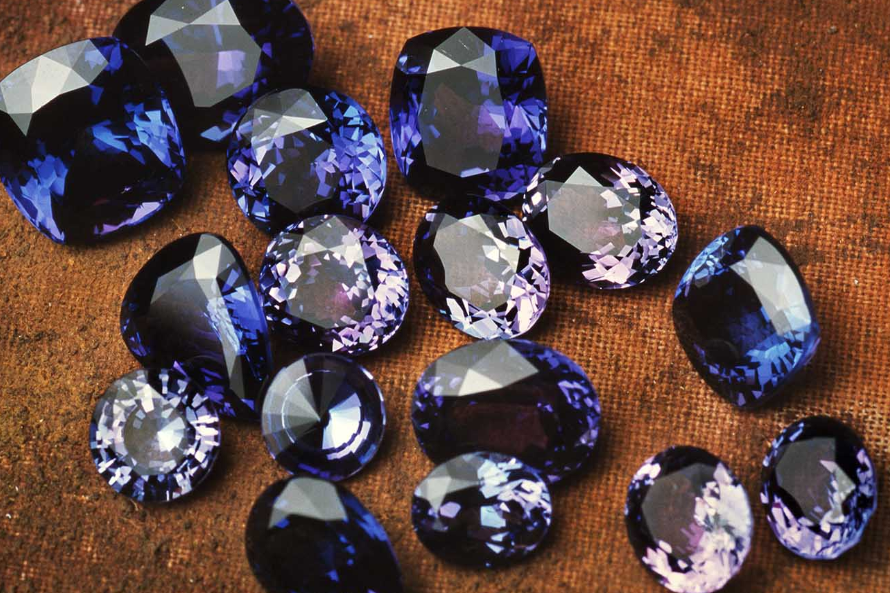 A group of sixteen blue gemstones