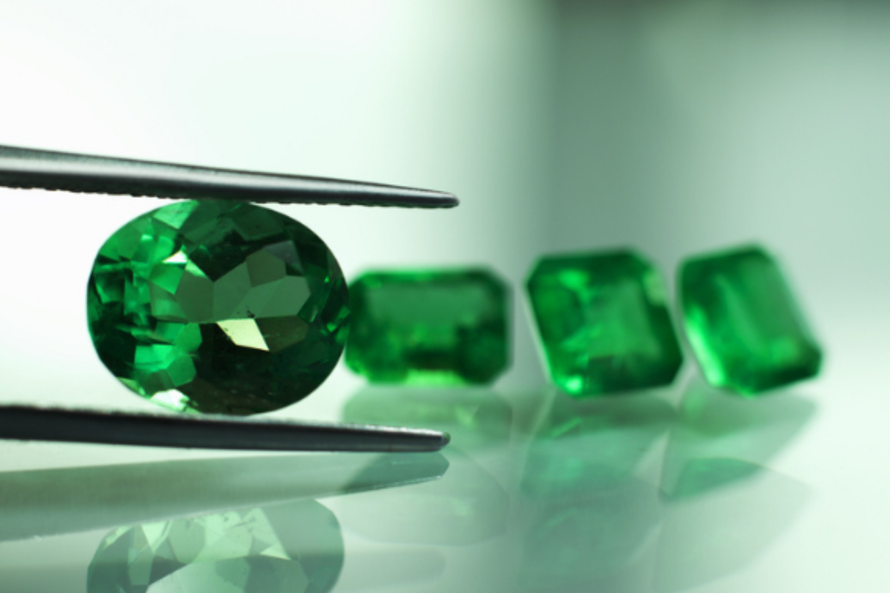 A prong selects one emerald