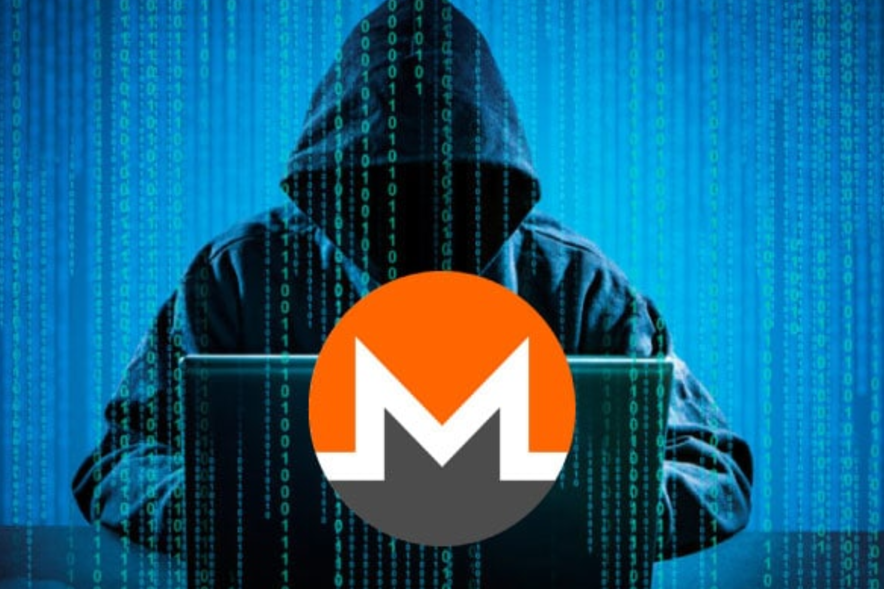A person with expertise in computers sitting in front of the Monero logo