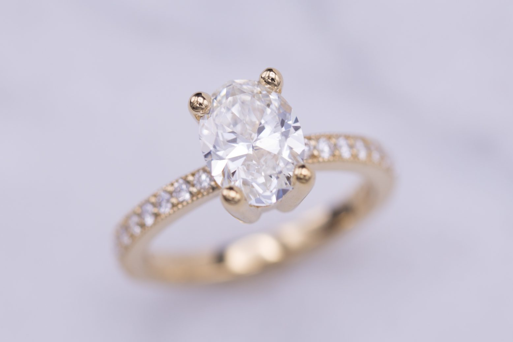 A diamond ring with an oval cut