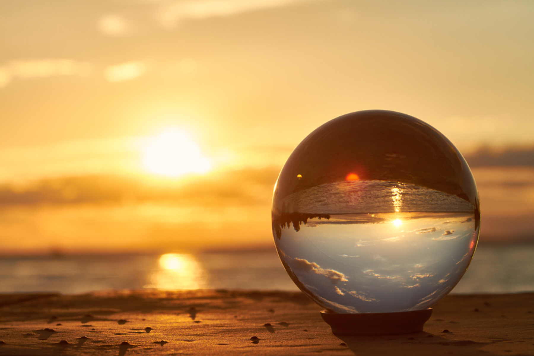 In front of the sunset, a crystal ball