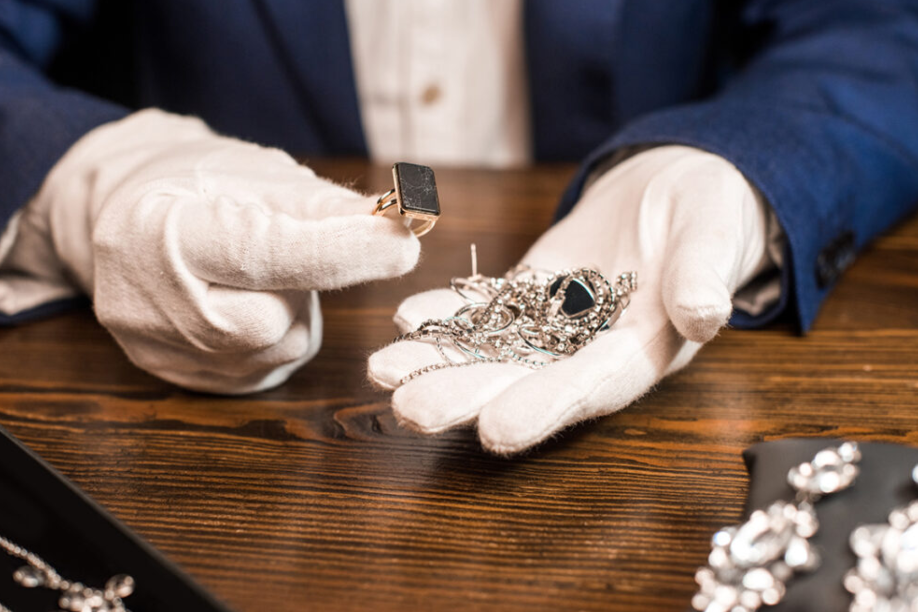 An expert with a collection of vintage jewelry