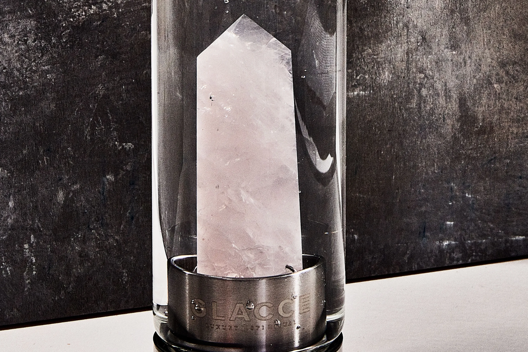 A pure quartz crystal in a glass container