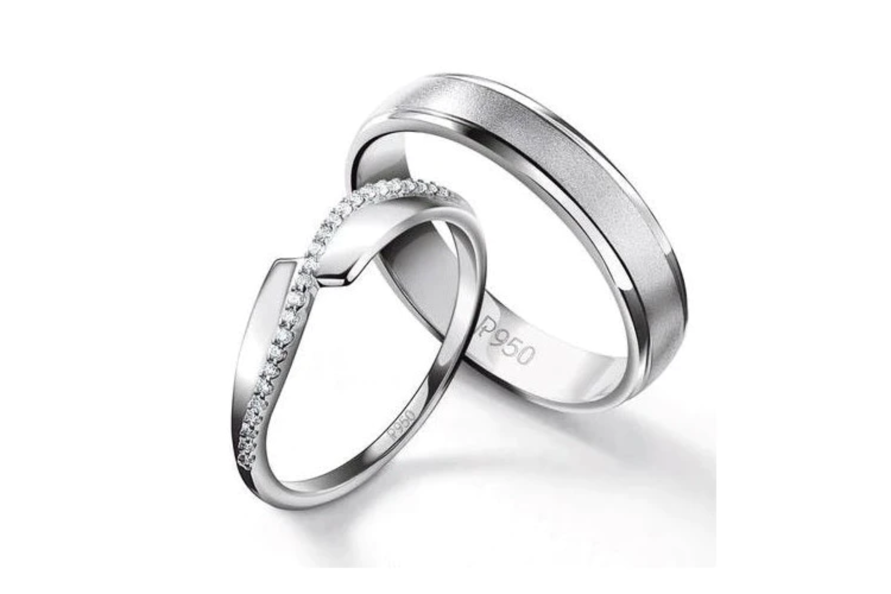 Two platinum rings with a matte finish in the center and a designer ring with a row of diamonds