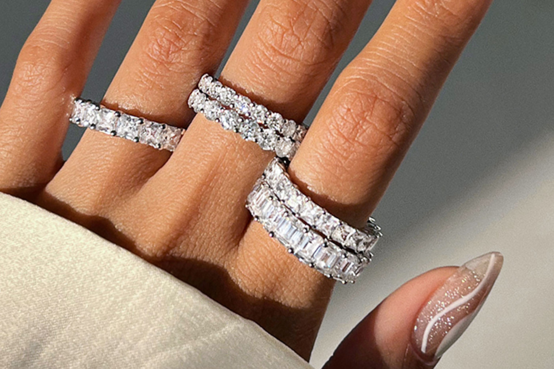 Five eternity bands adorn a woman's hand