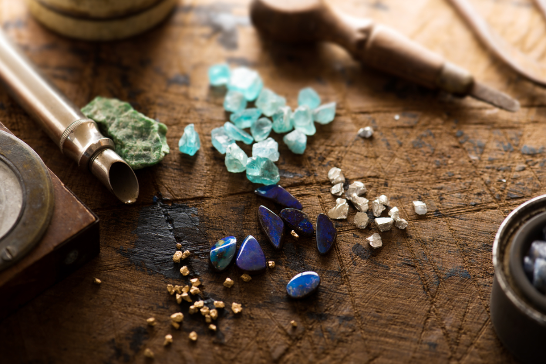 Many varieties of gemstone nuggets at the table
