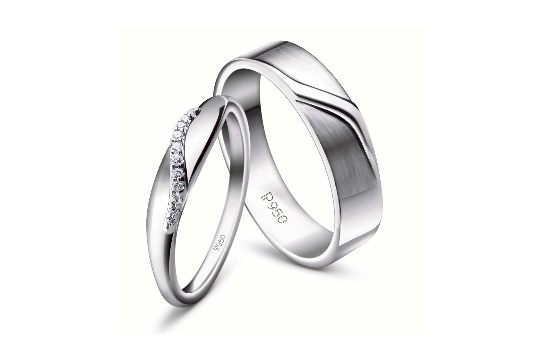 Two platinum rings raised line on the wide ring is finished in high polish, and a thin ring with diamond bits