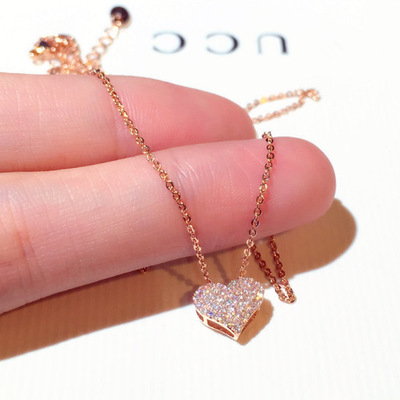 The Heart of the Matter Choker Necklace in a finger