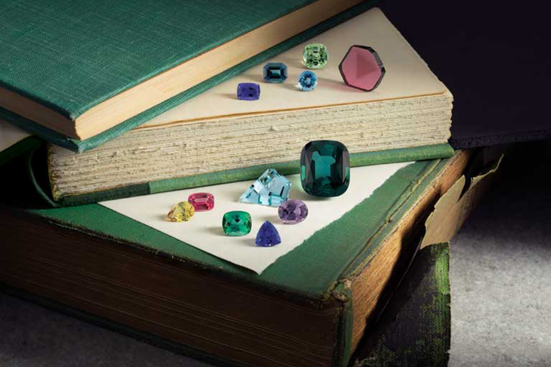 Various types of gemstones in books