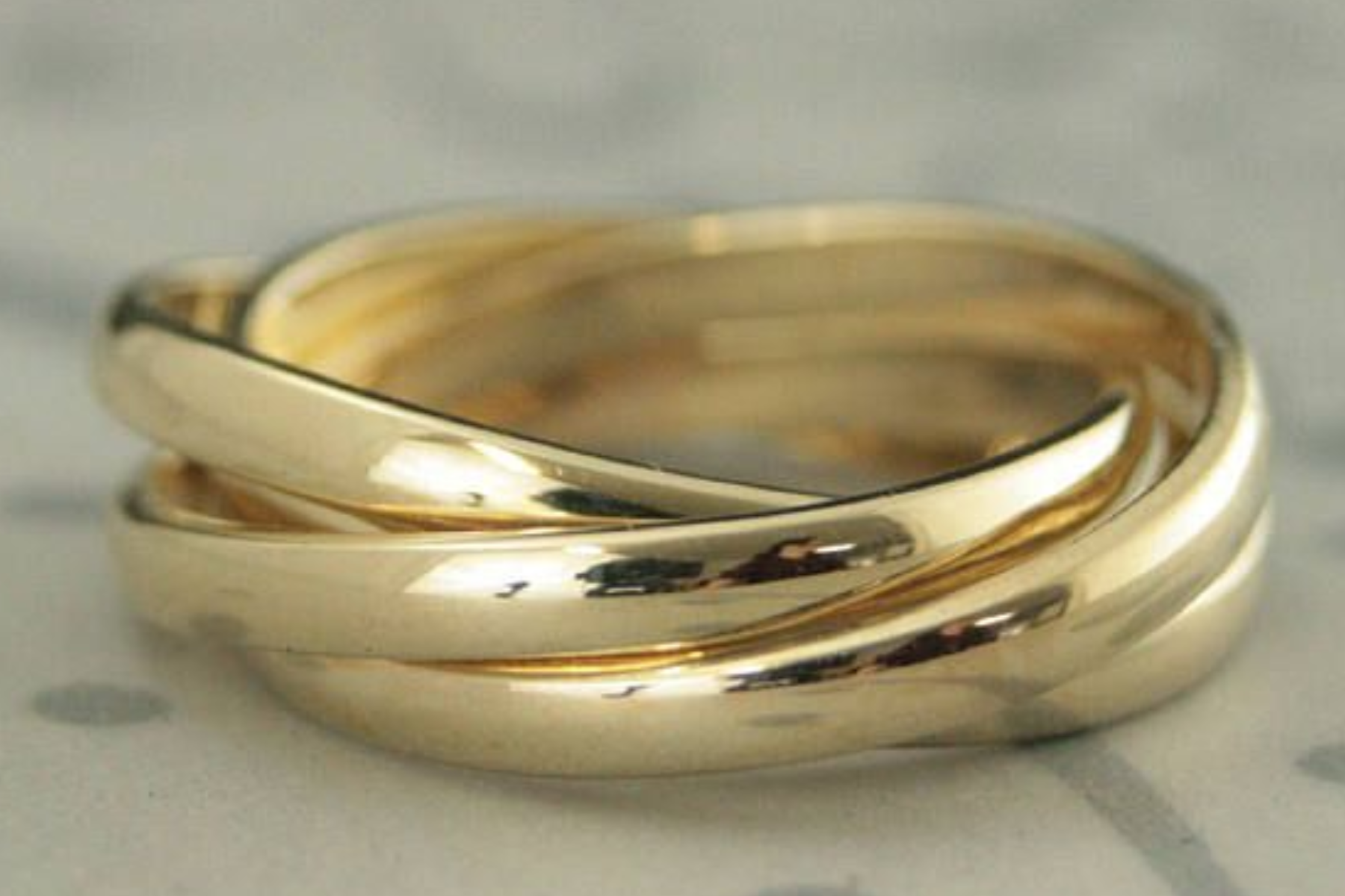 A gold ring with interlocking rings