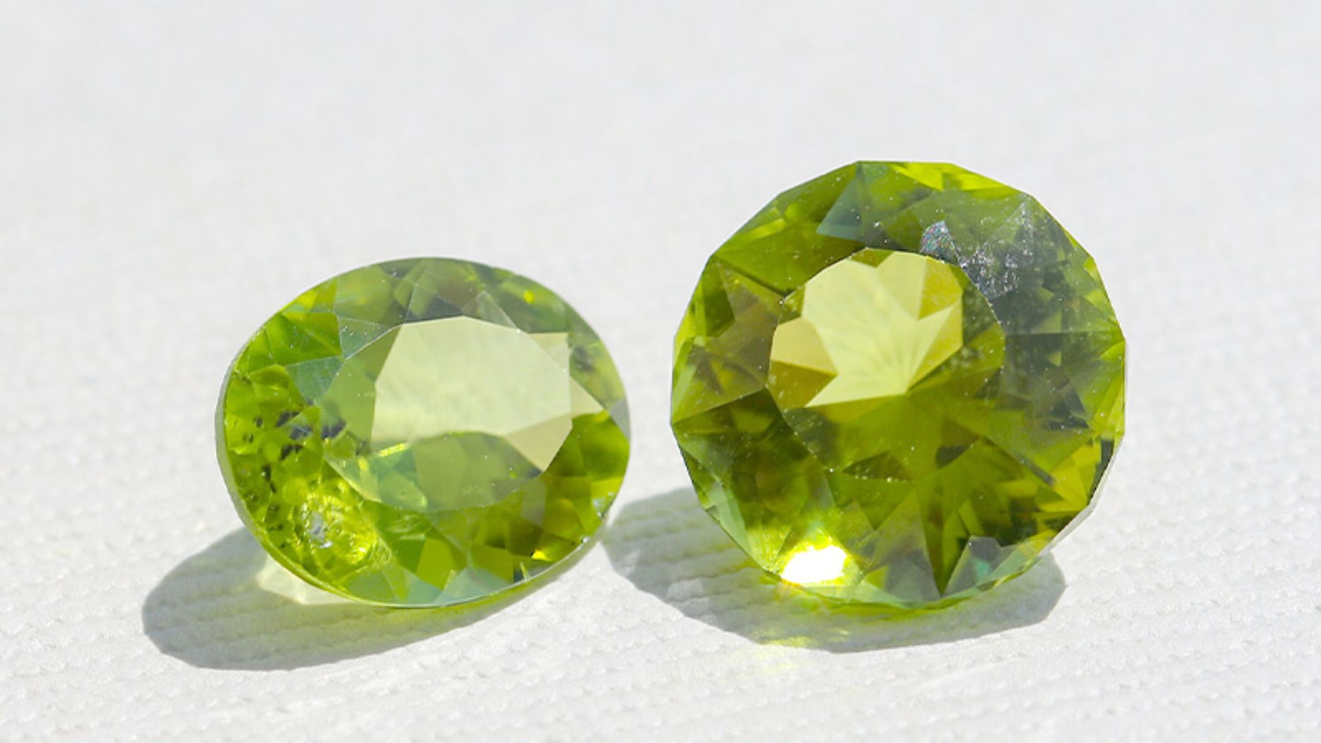 Two Peridot Gemstones Side By Side