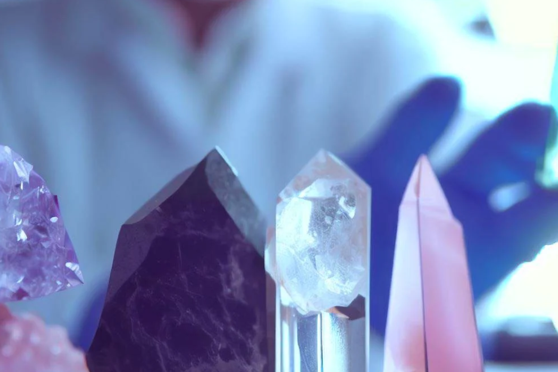 A scientist stands in front of the gems