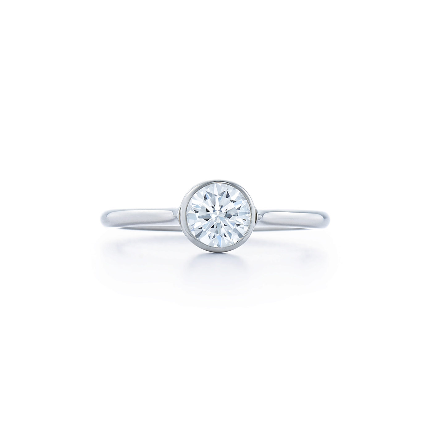 Engagement Ring with a Bezel Set Round Brilliant Diamond in Platinum