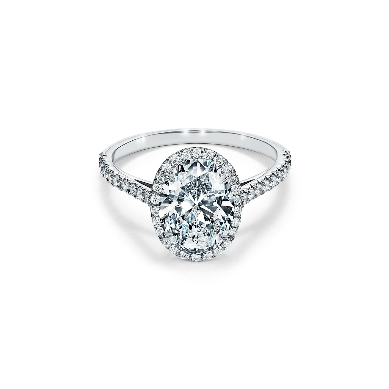 Halo Engagement Ring With A Diamond Band In Platinum