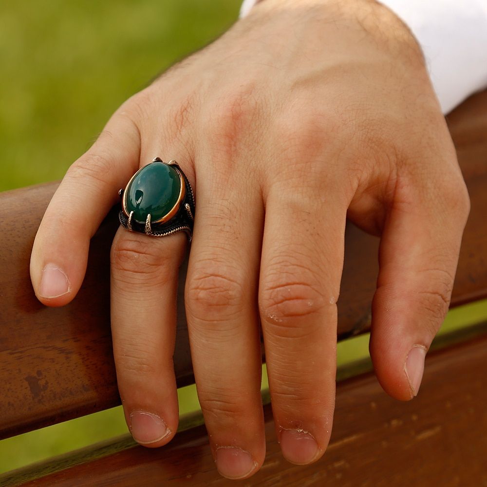 A ring made of green onyx that is worn on the ring finger