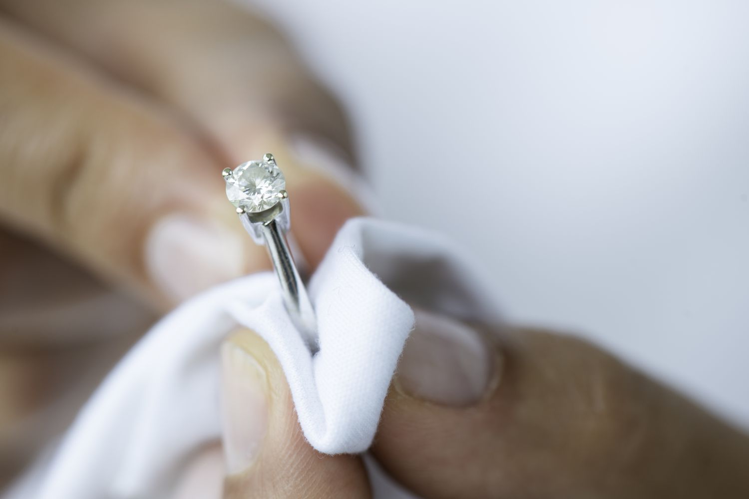 Cleaning Silver Diamond Ring With White Cloth