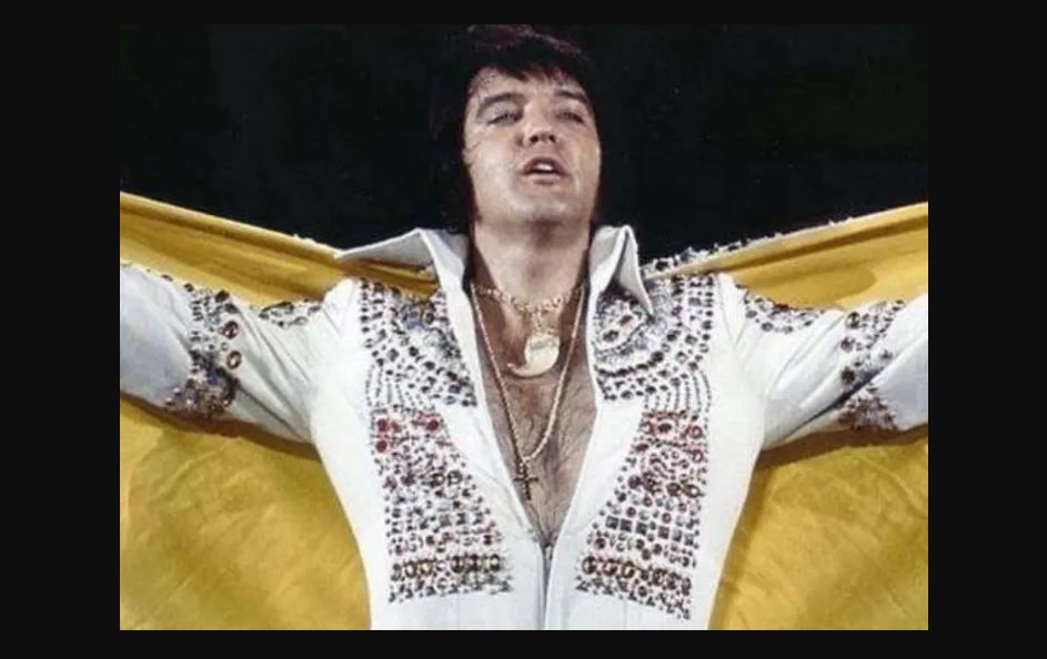 Elvis Presley performing while wearing the Lion Claw necklace