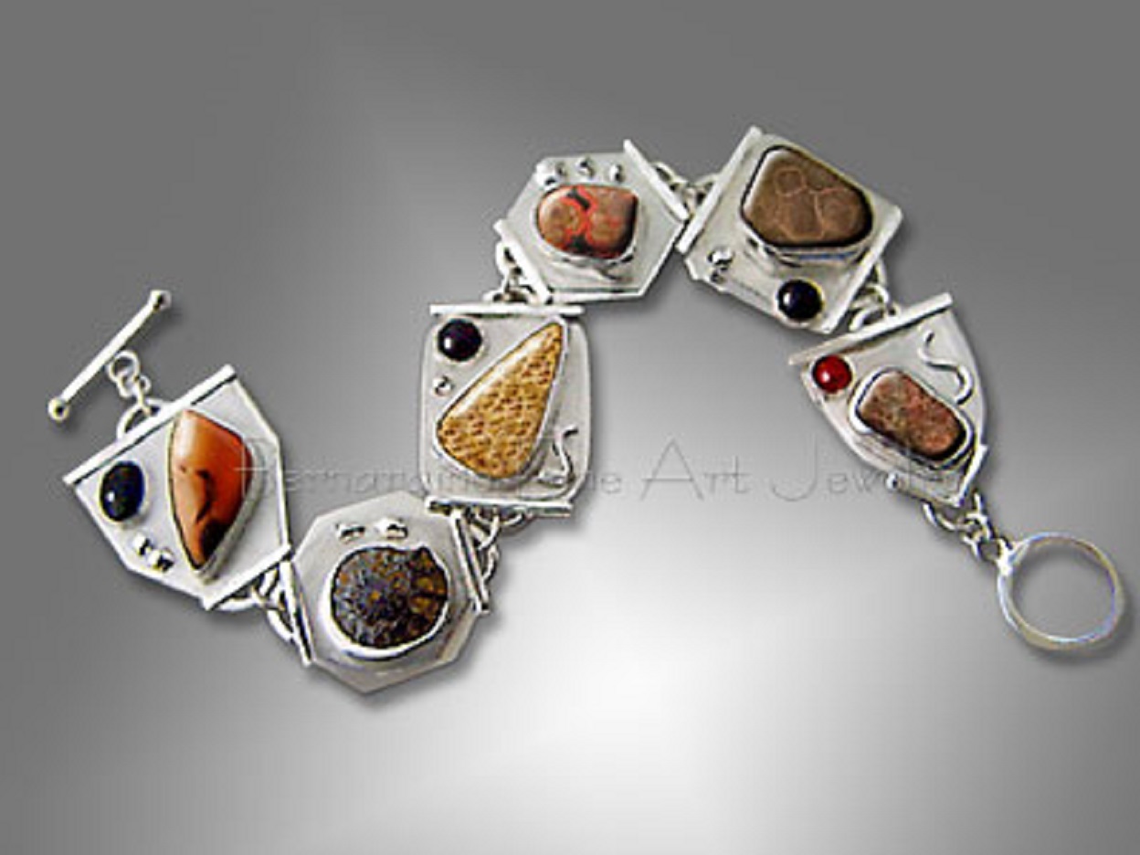 A bracelet with six cabochons on sterling silver linked together