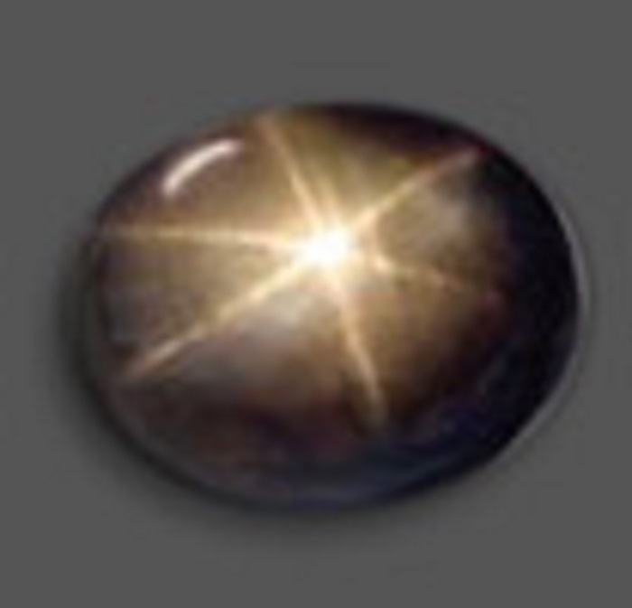 A black star sapphire, with four thin lines intersecting at the middle