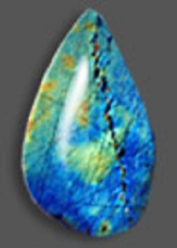 A polished teardrop-shaped blue spectrolite, with patterns in different shades