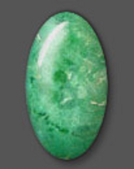 A polished oval-shaped that is more elongated green variscite
