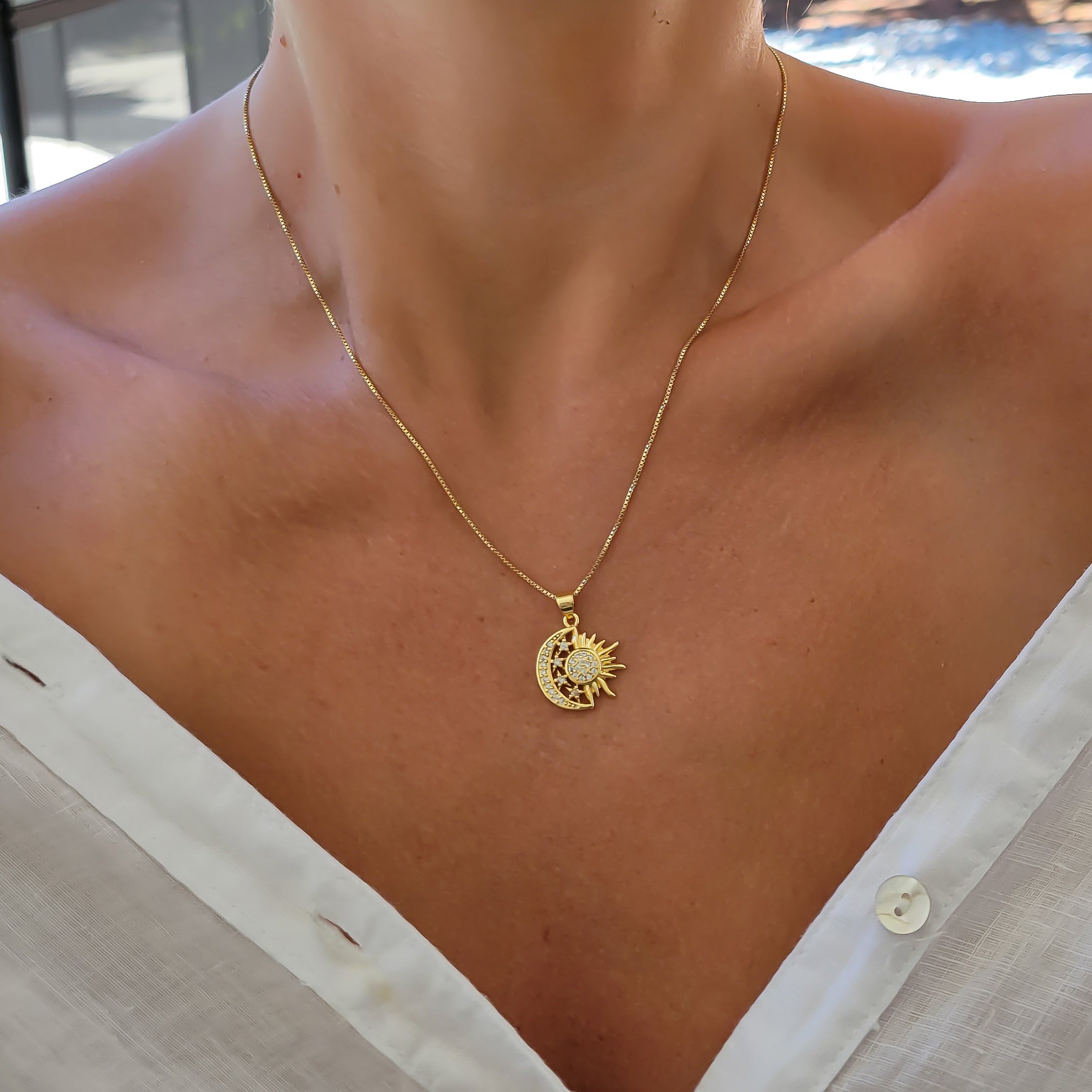 Woman Wearing Gold Filled Sun and Moon Necklace