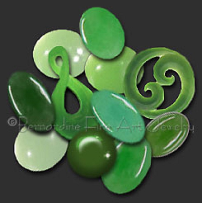 Eleven pieces jade in different shapes but mostly oval ones and varying shades of green