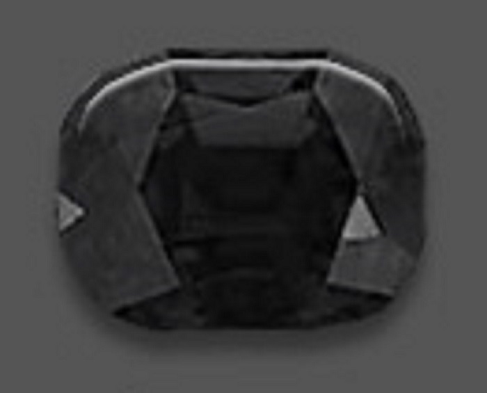 A rectangular black spinel with curved edges and polished surface
