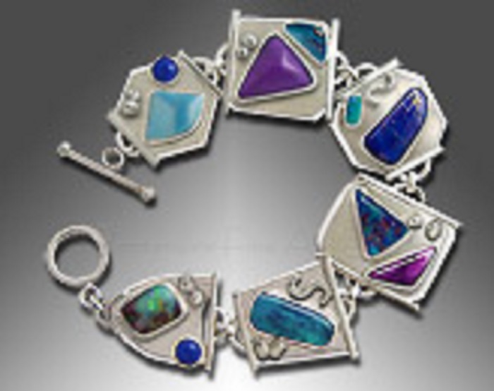 A silver larimar bracelet with azurite/malachite, boulder opal, chrysocolla, lapis lazuli and sugilite