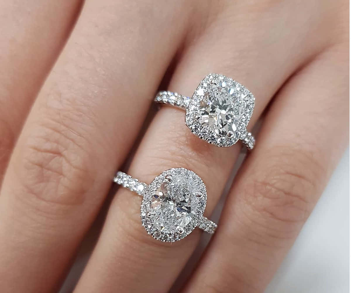 Two Diamond Engagement Rings In One Finger