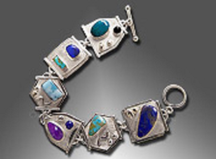 A silver five-link larimar bracelet with onyx, chrysocolla, boulder opal, turquoise, sugilite and lapis lazuli
