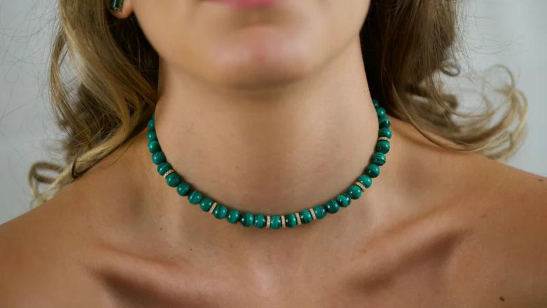 Woman Wearing Malachite Bead Necklace